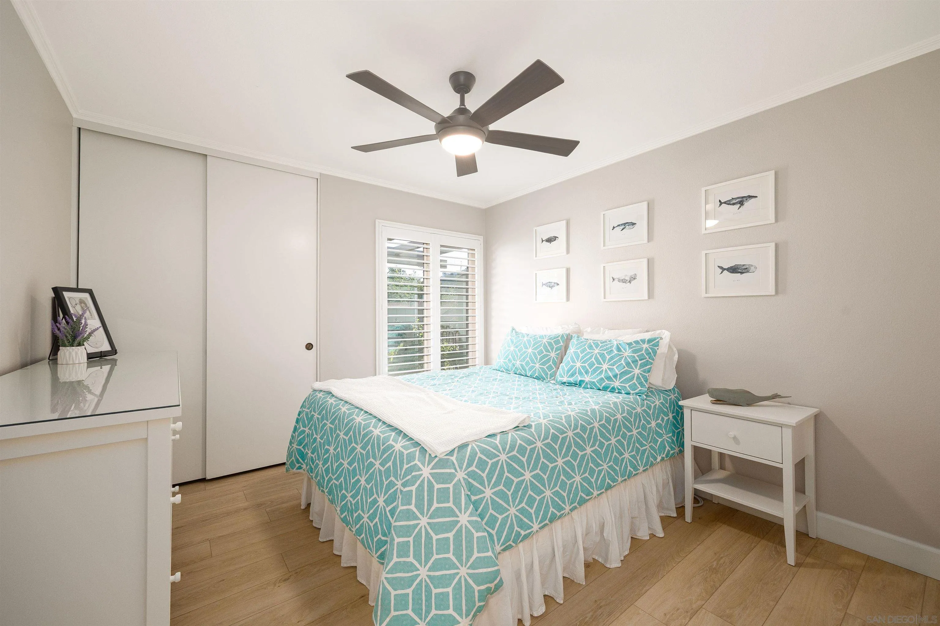 5611 Adobe Falls Road, Unit A San Diego, CA 92120 - Photo 13 of 30 a bedroom with a bed and a window