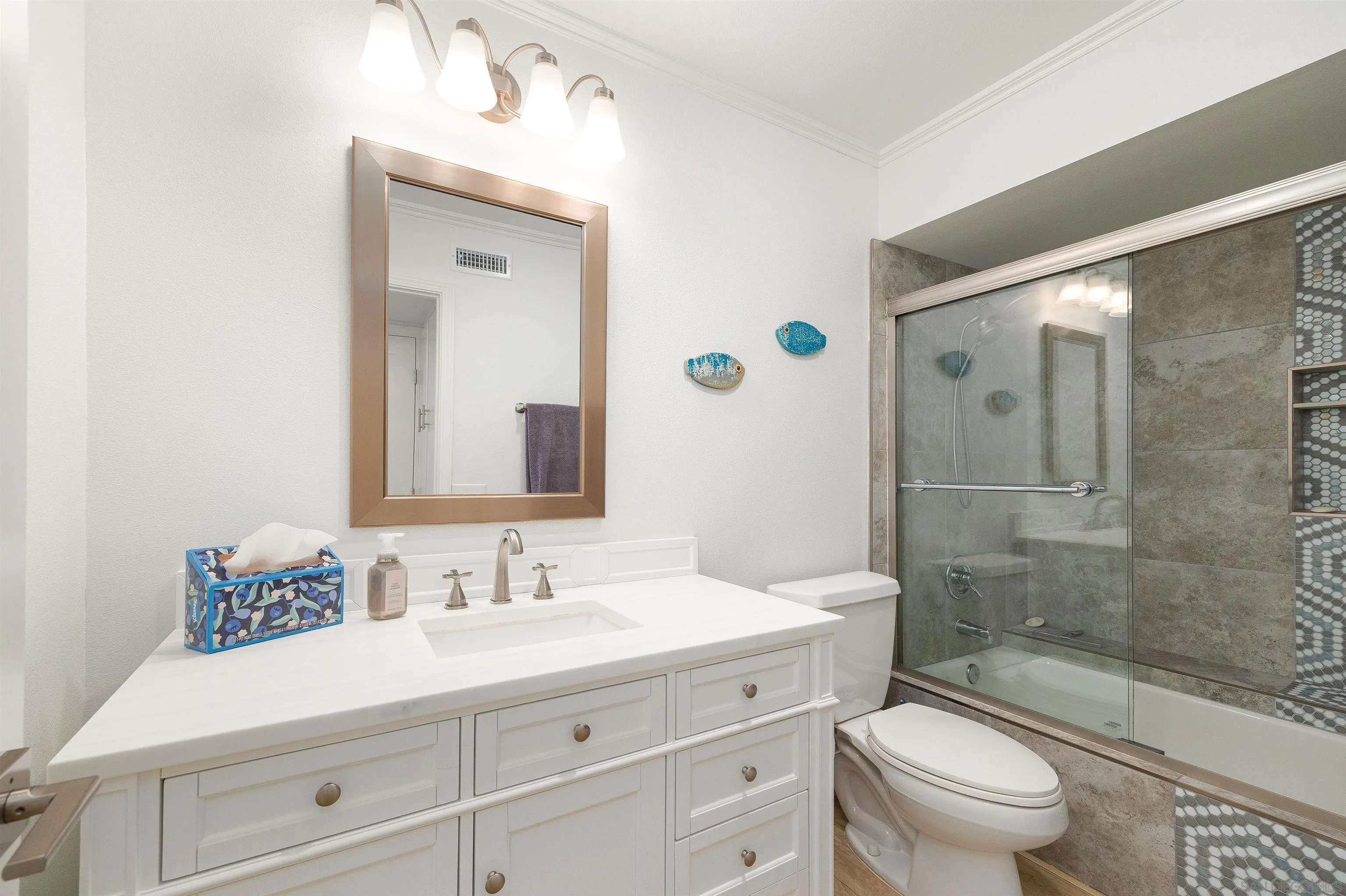5611 Adobe Falls Road, Unit A San Diego, CA 92120 - Photo 15 of 30 a bathroom with a sink a toilet and shower