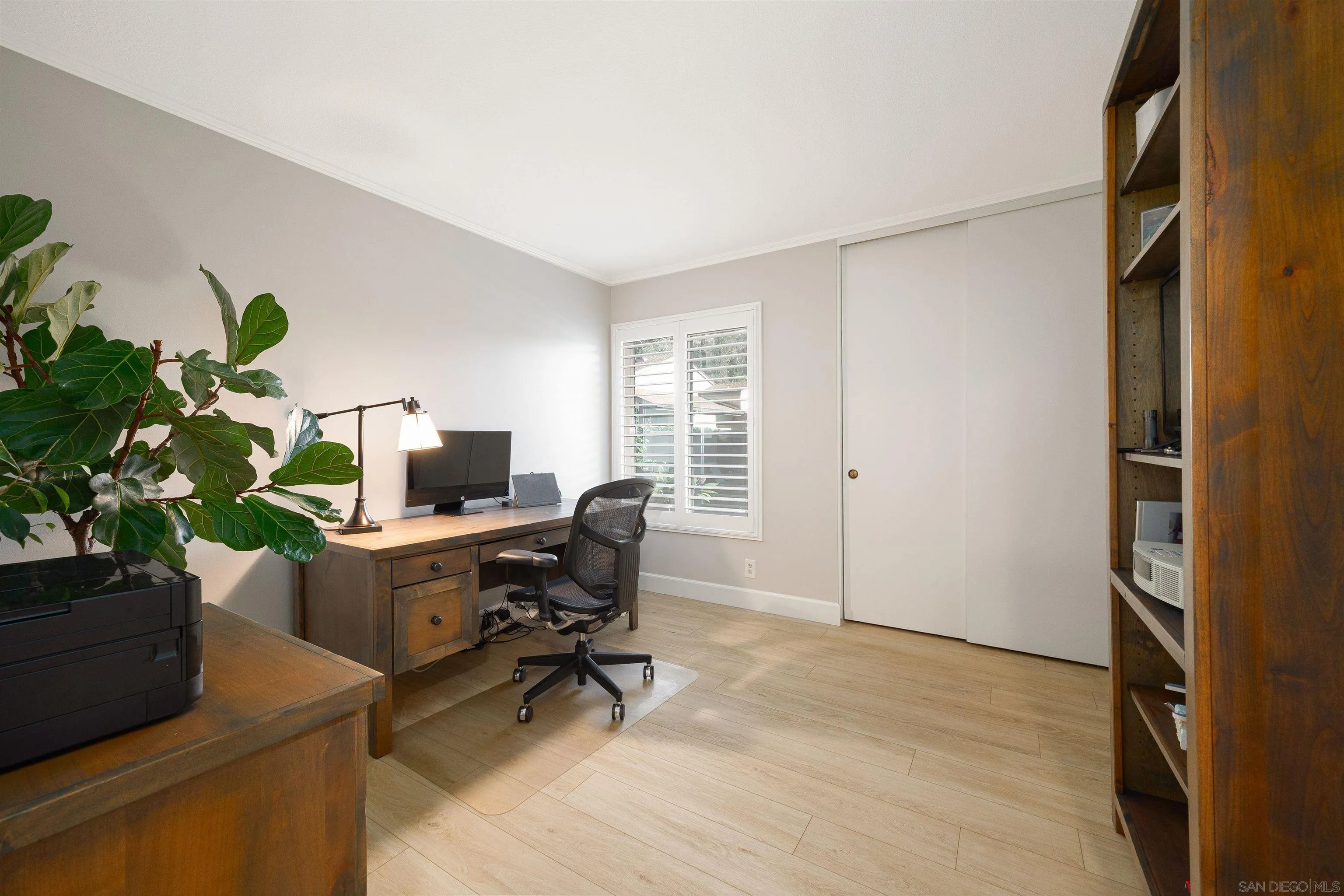 5611 Adobe Falls Road, Unit A San Diego, CA 92120 - Photo 16 of 30 a view of a workspace with furniture and a window