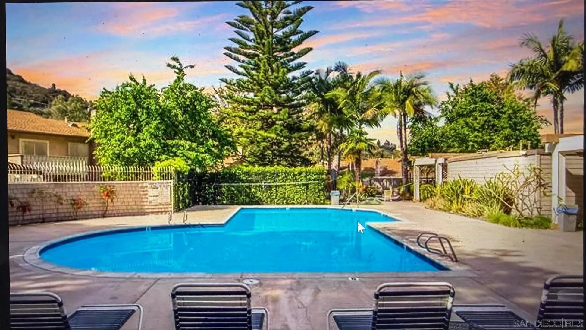 5611 Adobe Falls Road, Unit A San Diego, CA 92120 - Photo 18 of 30 a view of a backyard with swimming pool