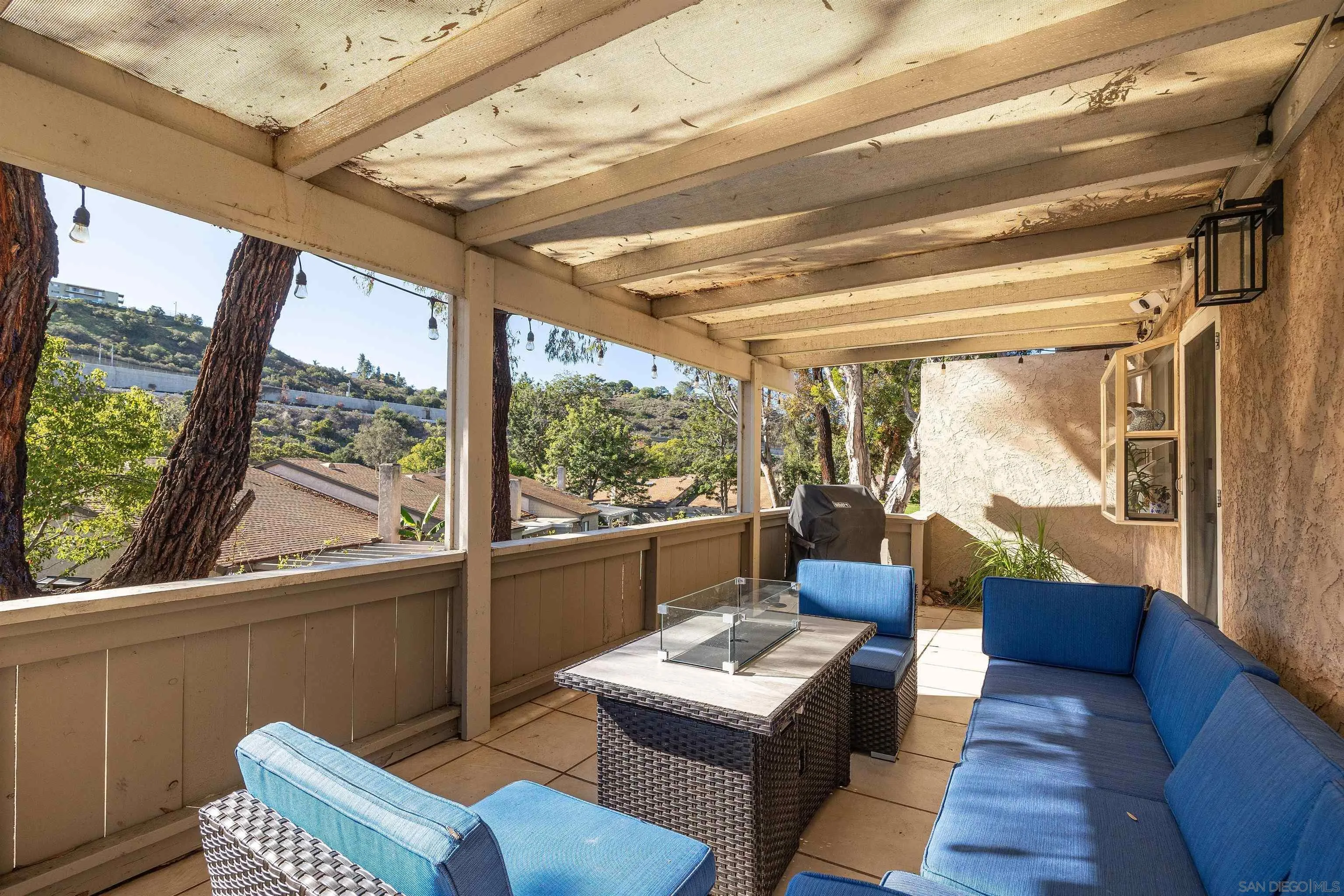 5611 Adobe Falls Road, Unit A San Diego, CA 92120 - Photo 20 of 30 a living room with furniture and a window