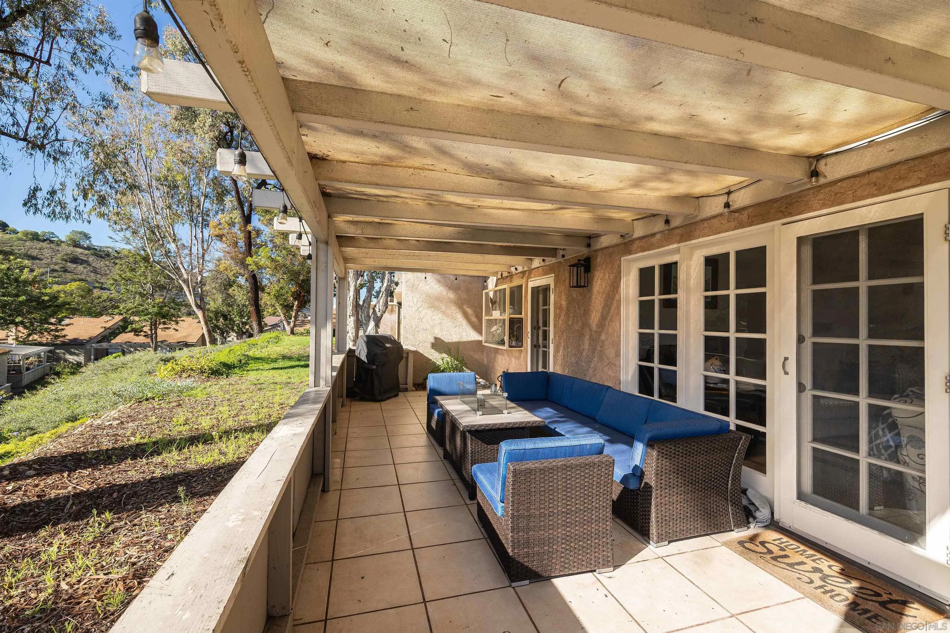 5611 Adobe Falls Road, Unit A San Diego, CA 92120 - Photo 21 of 30 a view of a porch with furniture