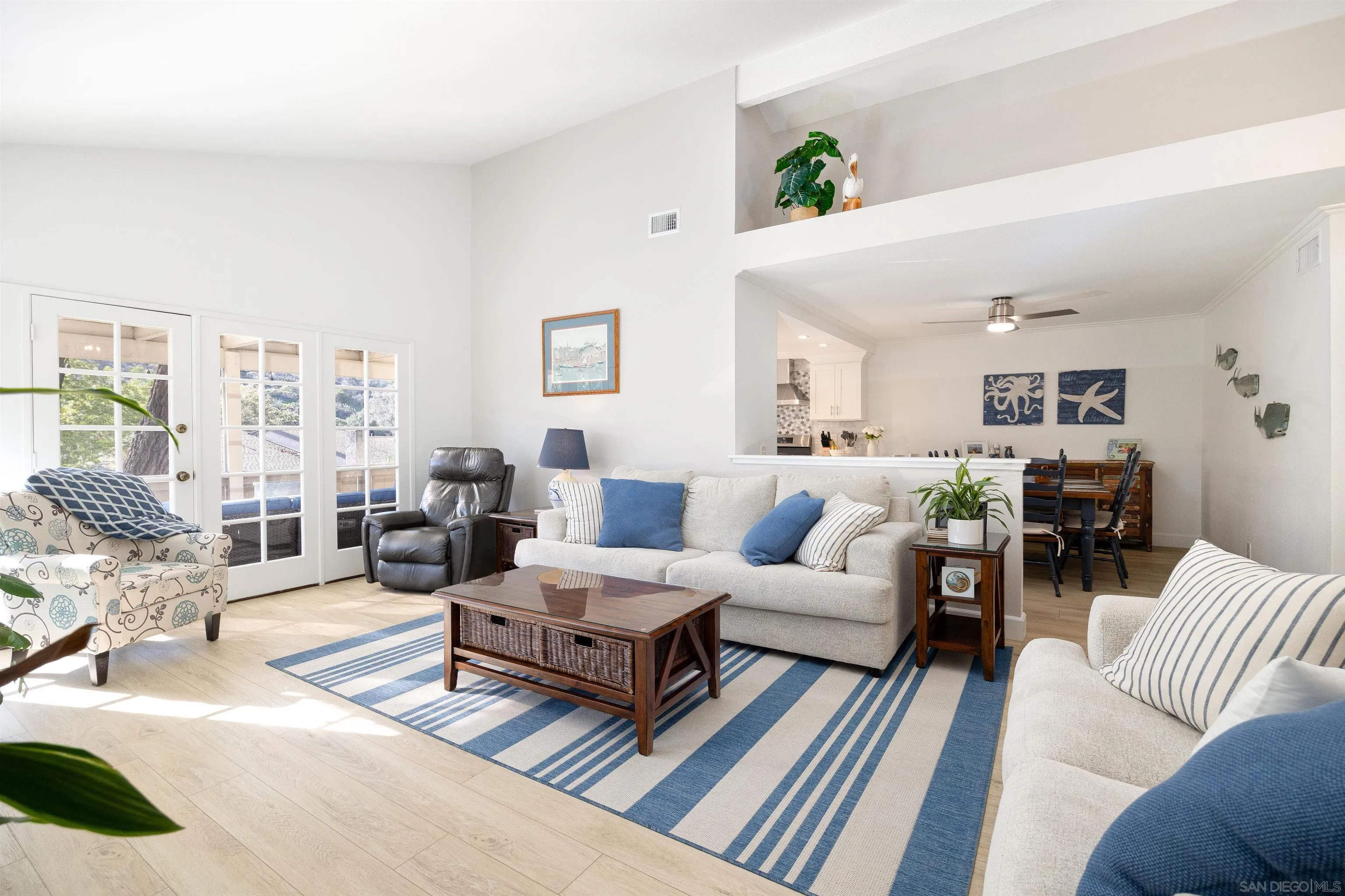 5611 Adobe Falls Road, Unit A San Diego, CA 92120 - Photo 7 of 30 a living room with furniture wooden floor and a large window