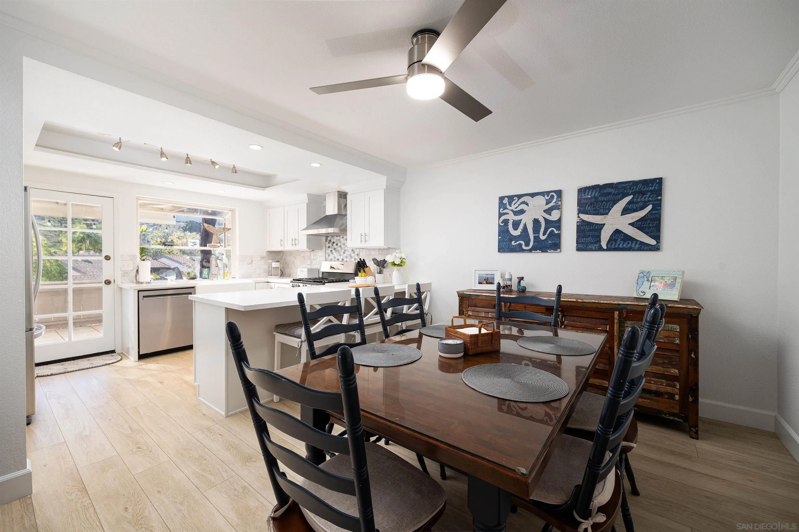5611 Adobe Falls Road, Unit A San Diego, CA 92120 - Photo 8 of 30 a view of a dining room with furniture and a livingroom