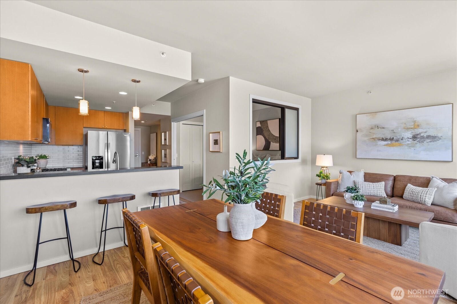 76 Cedar Street, Unit PH07 Seattle, WA 98121 - Photo 8 of 33 a kitchen with a table and chairs in it