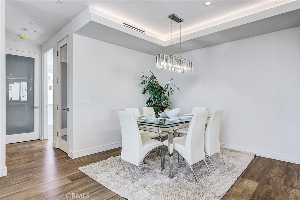 2701 Ruhland Avenue Redondo Beach, CA 90278 - Photo 16 of 38 a view of a dining room with furniture and wooden floor