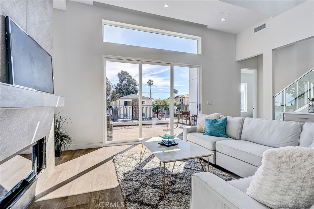 2701 Ruhland Avenue Redondo Beach, CA 90278 - Photo 21 of 38 a living room with furniture and a fireplace