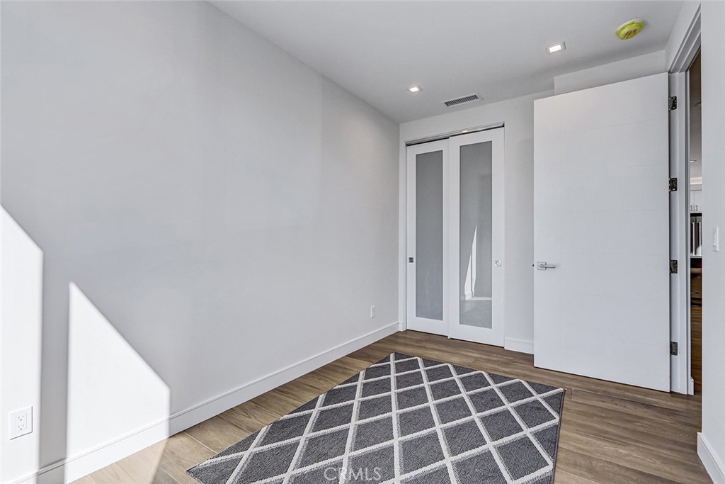 2701 Ruhland Avenue Redondo Beach, CA 90278 - Photo 35 of 38 a view of an empty room with wooden floor