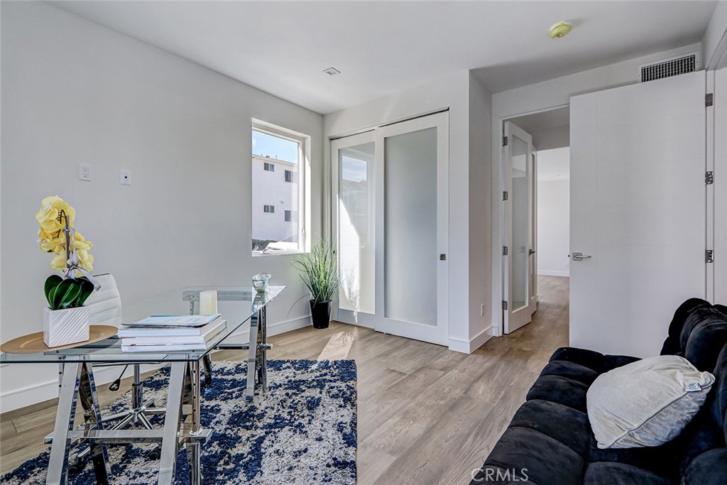 2701 Ruhland Avenue Redondo Beach, CA 90278 - Photo 5 of 38 a workspace with furniture and wooden floor