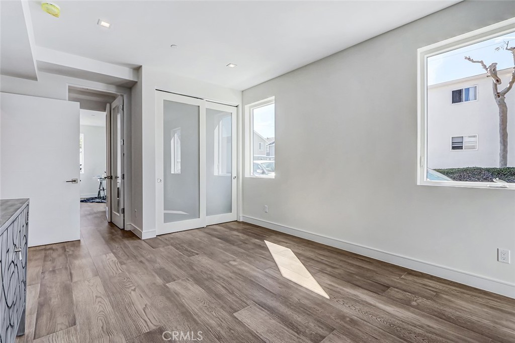 2701 Ruhland Avenue Redondo Beach, CA 90278 - Photo 8 of 38 wooden floor in an empty room with a window