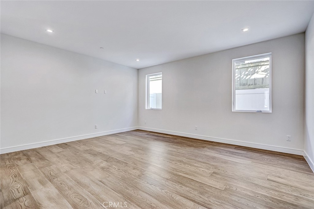 2701 Ruhland Avenue Redondo Beach, CA 90278 - Photo 9 of 38 a view of an empty room with wooden floor and window
