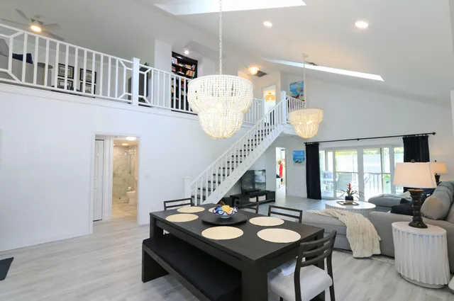 a kitchen with a refrigerator and a sink