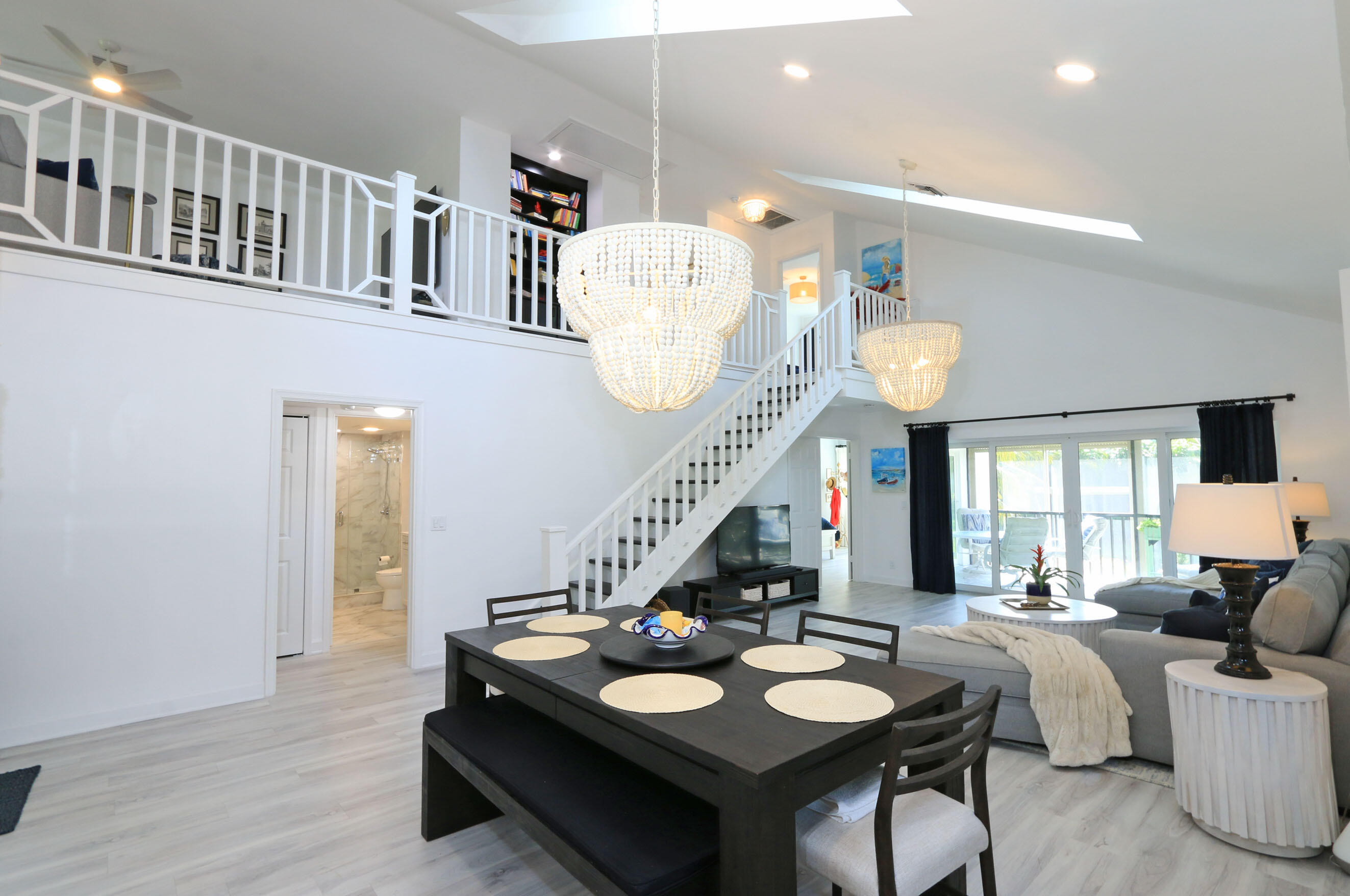 4161 U.S. Highway 1, Unit E3 Jupiter, FL 33477 - Photo 12 of 86 a living room with furniture and wooden floor