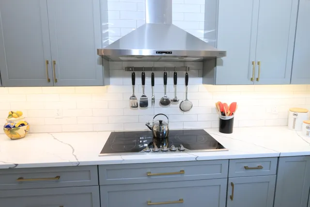 a dining room with furniture water view and a floor to ceiling window