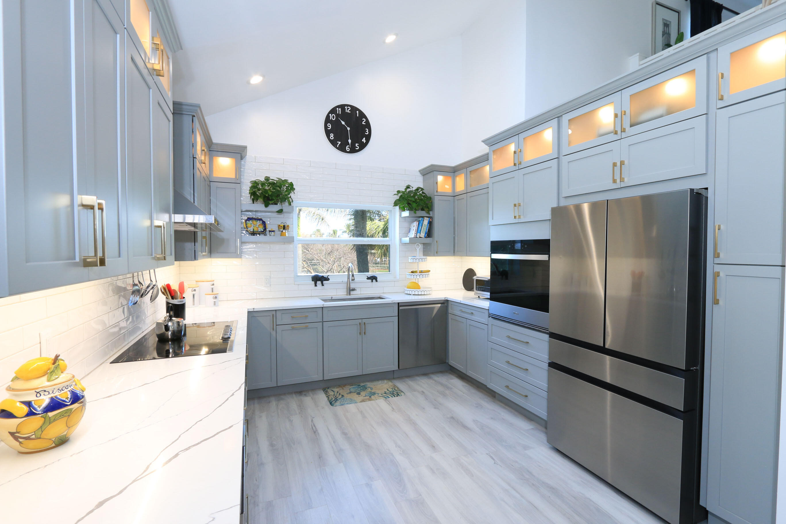 4161 U.S. Highway 1, Unit E3 Jupiter, FL 33477 - Photo 18 of 86 a kitchen with a refrigerator and a sink