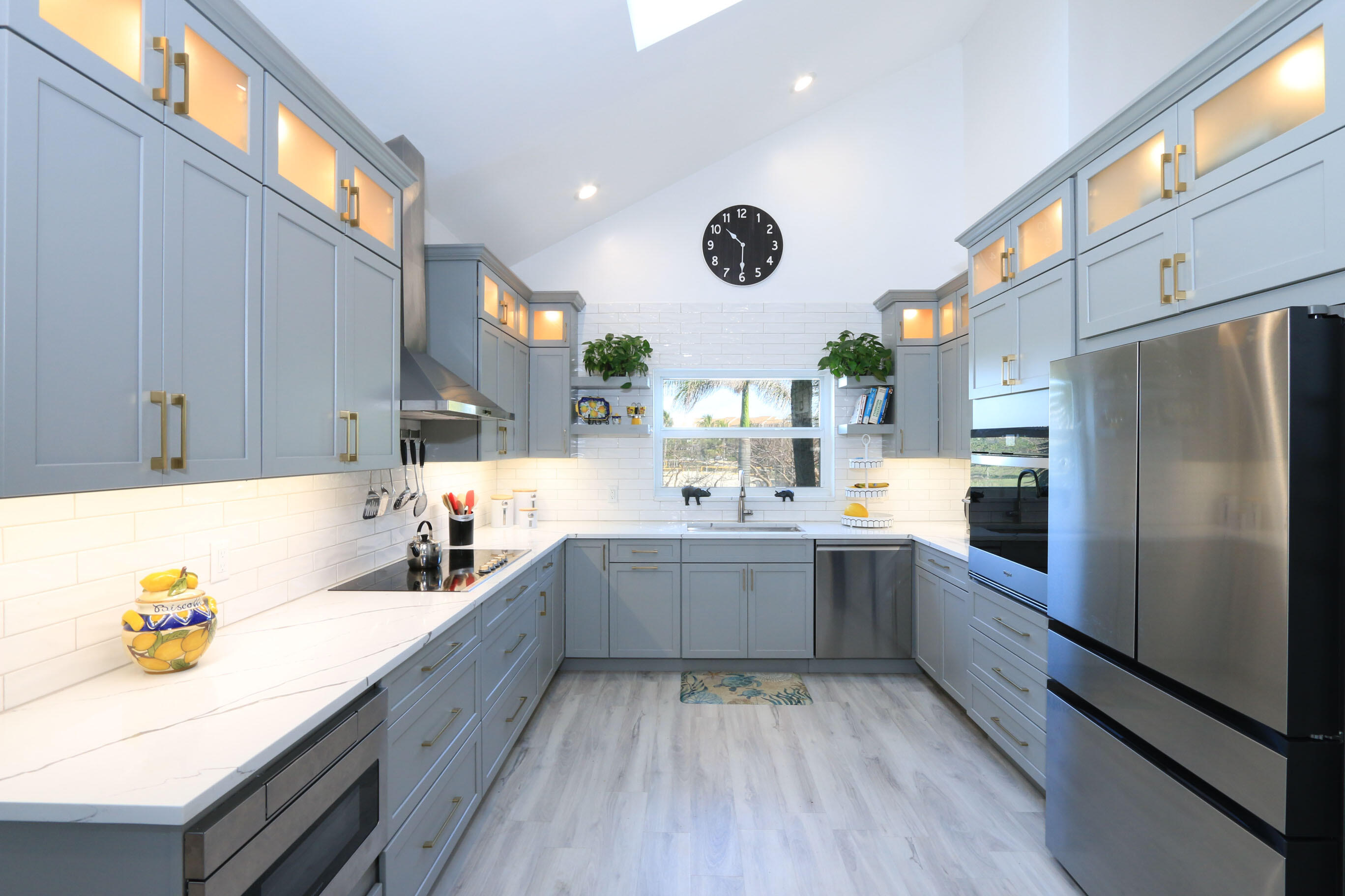 4161 U.S. Highway 1, Unit E3 Jupiter, FL 33477 - Photo 21 of 86 a kitchen with cabinets and stainless steel appliances