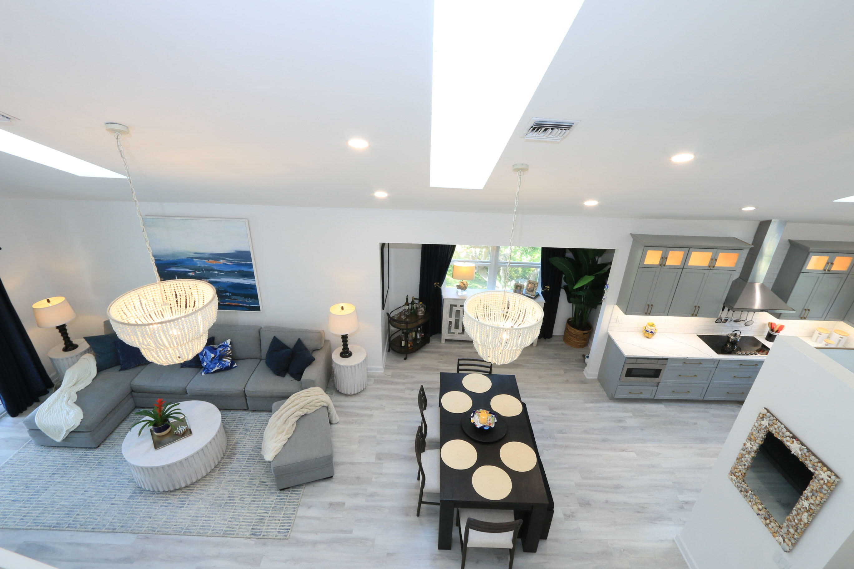 4161 U.S. Highway 1, Unit E3 Jupiter, FL 33477 - Photo 24 of 86 a living room with furniture and a wooden floor