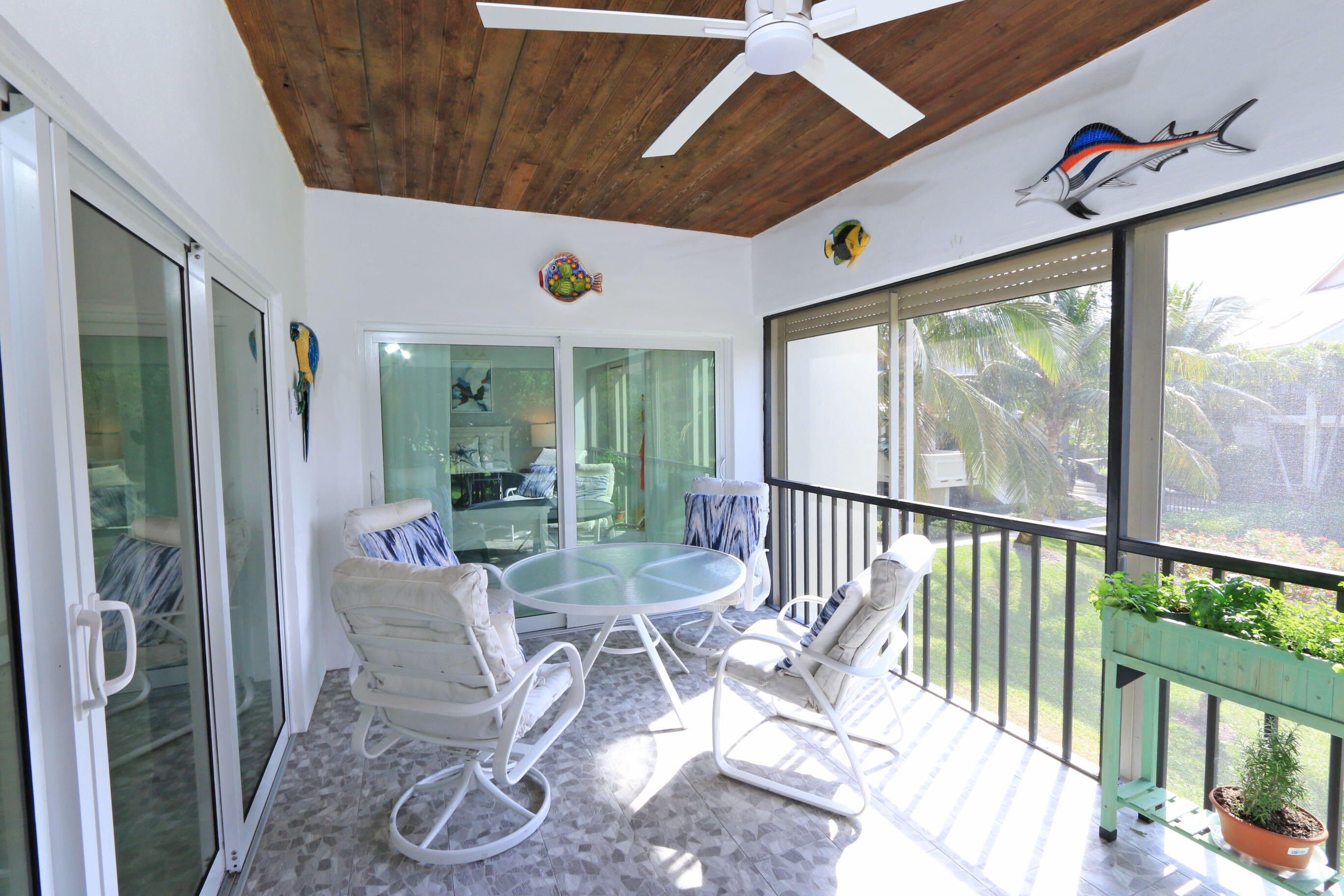 4161 U.S. Highway 1, Unit E3 Jupiter, FL 33477 - Photo 25 of 86 a dining room with furniture water view and a floor to ceiling window