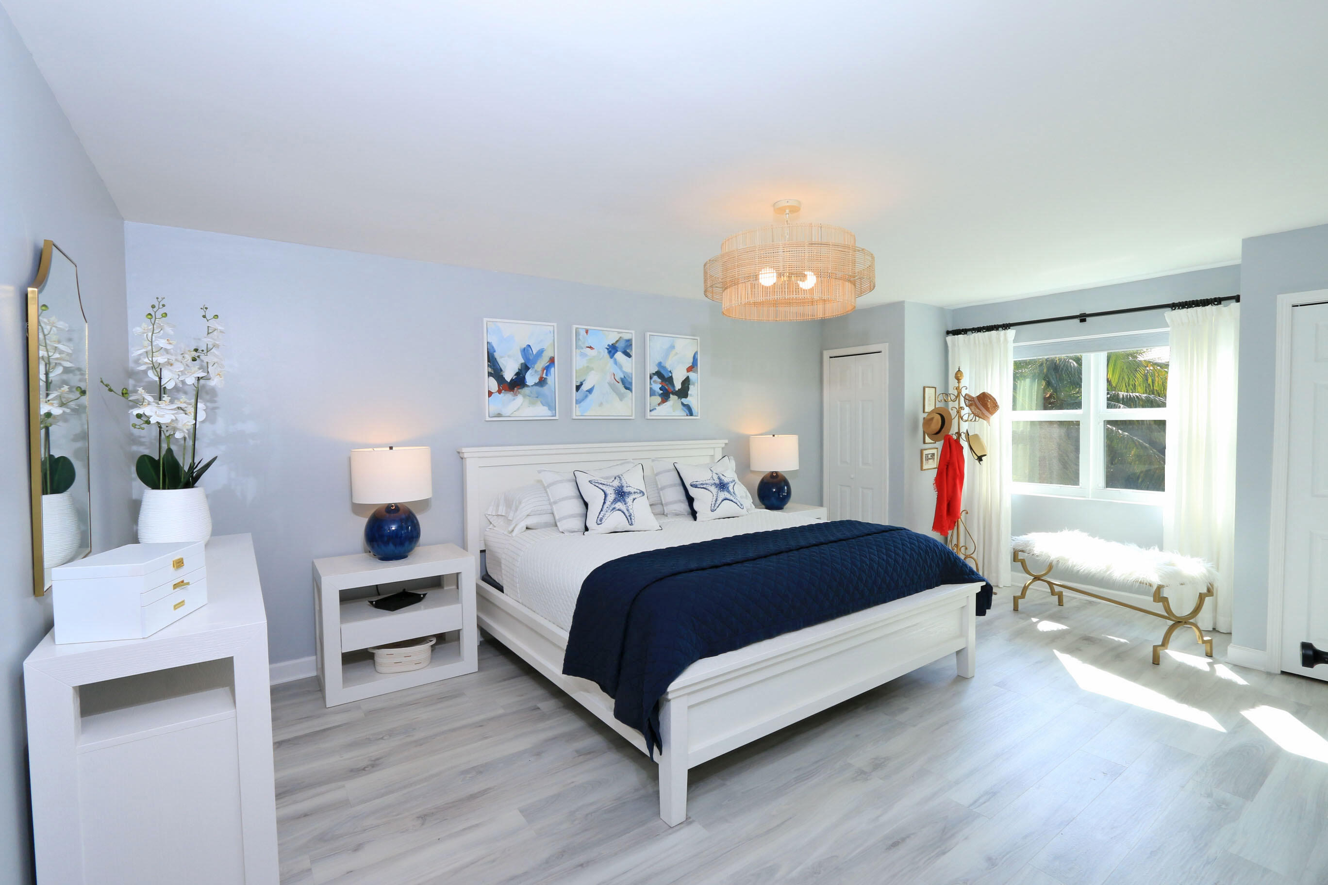 4161 U.S. Highway 1, Unit E3 Jupiter, FL 33477 - Photo 27 of 86 a bedroom with a bed and a table in it