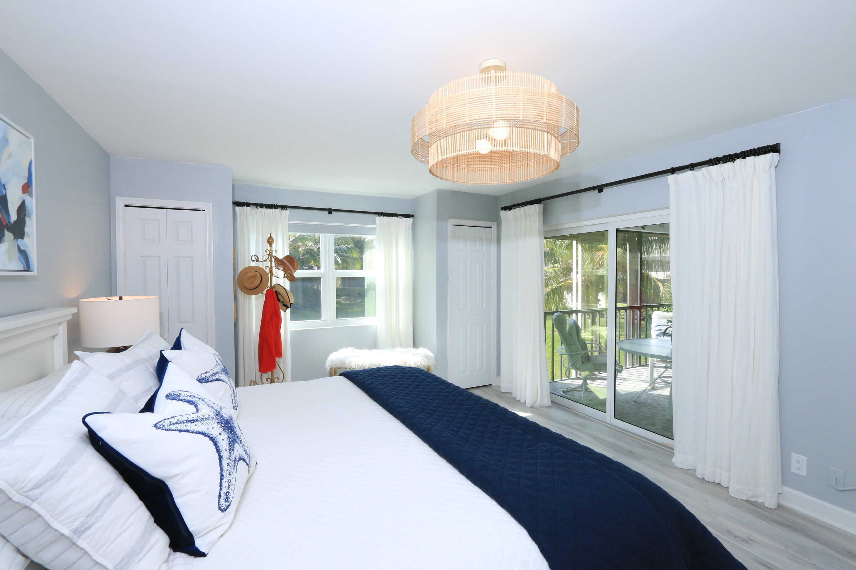 4161 U.S. Highway 1, Unit E3 Jupiter, FL 33477 - Photo 34 of 86 a very nice looking room with a large bed and a large window