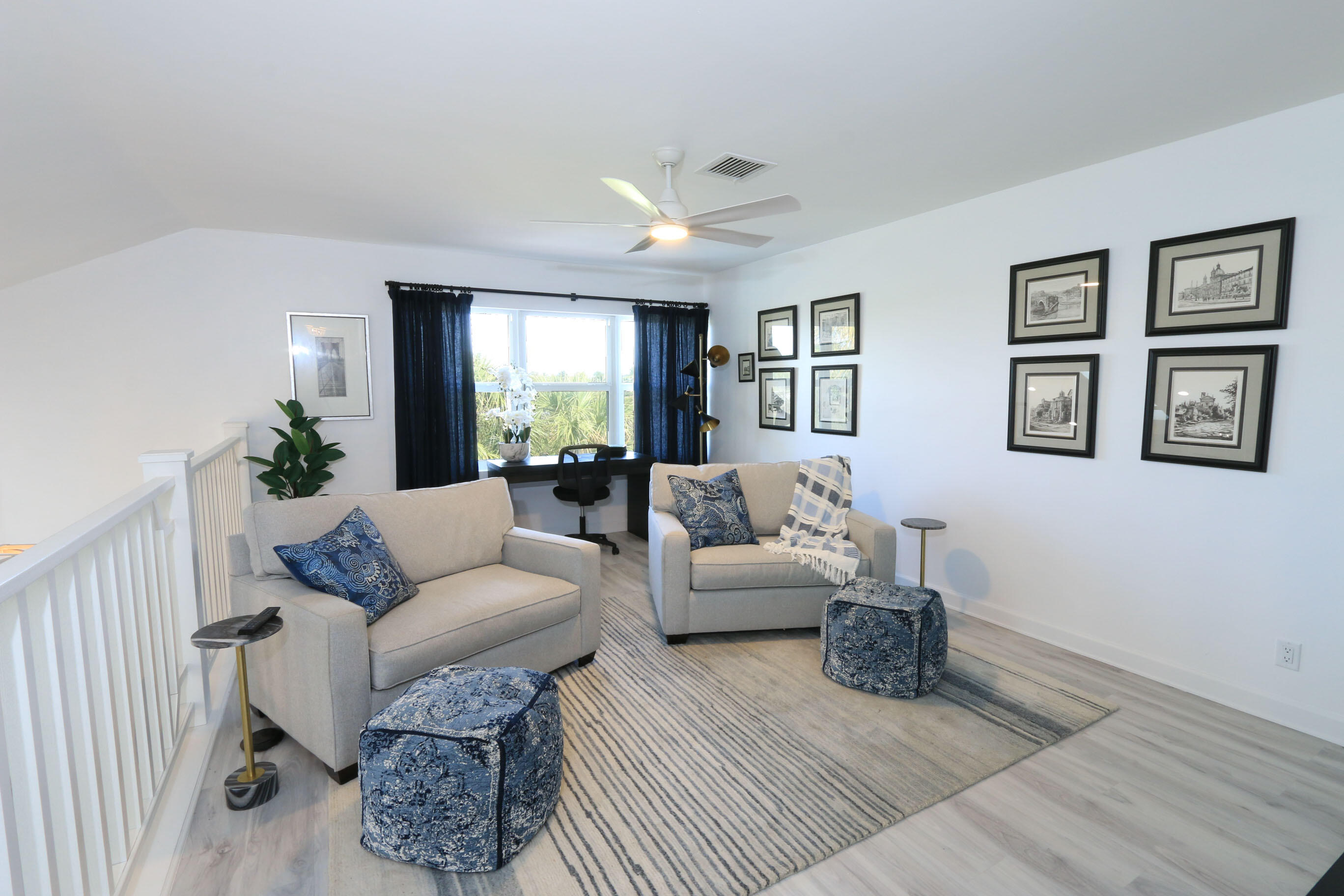 4161 U.S. Highway 1, Unit E3 Jupiter, FL 33477 - Photo 37 of 86 a living room with furniture and a large window