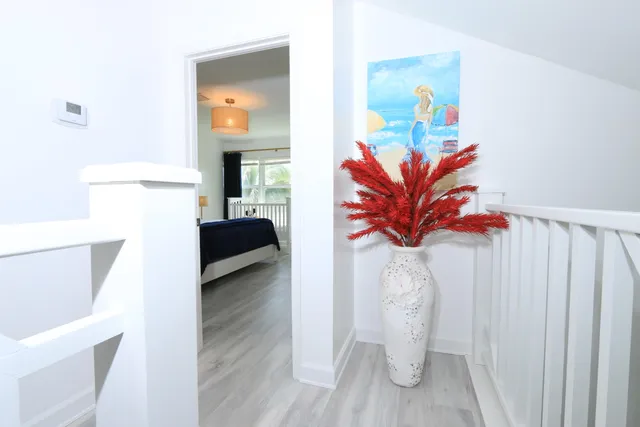 a wooden bench sitting in front of a building