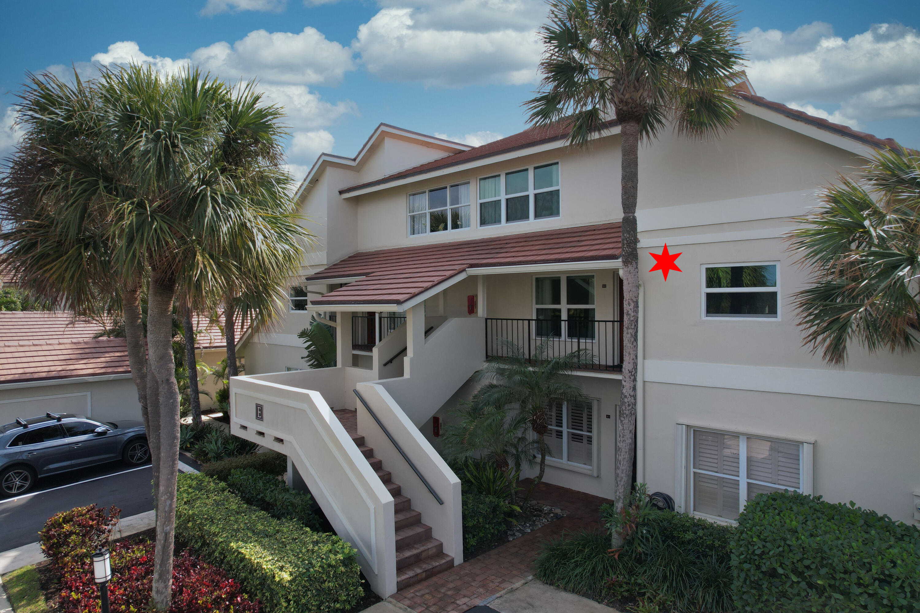 4161 U.S. Highway 1, Unit E3 Jupiter, FL 33477 - Photo 4 of 86 a front view of house with yard and trees around