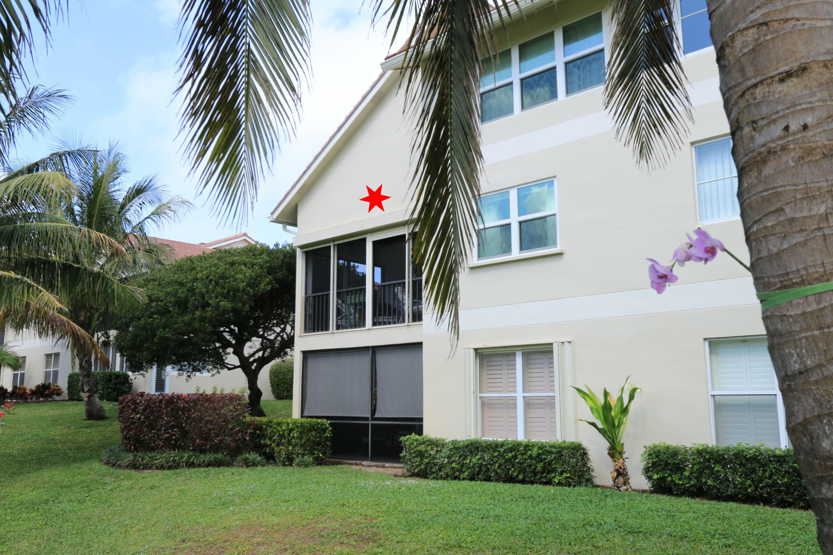 4161 U.S. Highway 1, Unit E3 Jupiter, FL 33477 - Photo 56 of 86 a front view of house with yard and green space