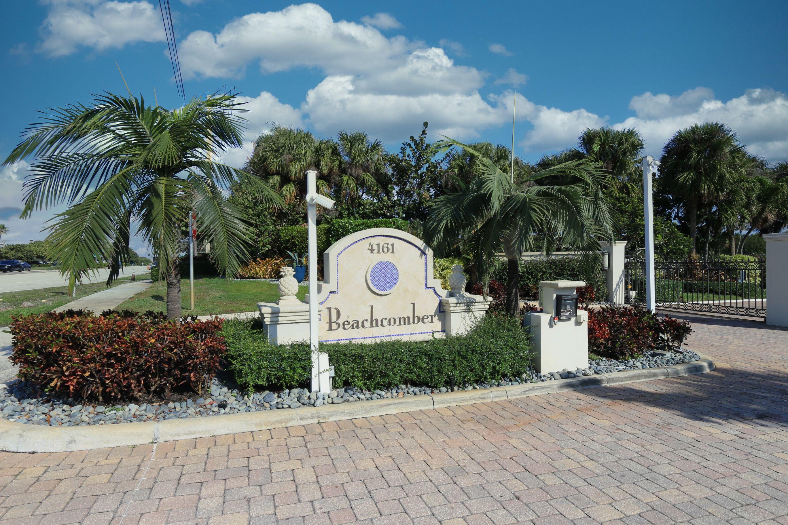 4161 U.S. Highway 1, Unit E3 Jupiter, FL 33477 - Photo 78 of 86 a wooden bench sitting in front of a building
