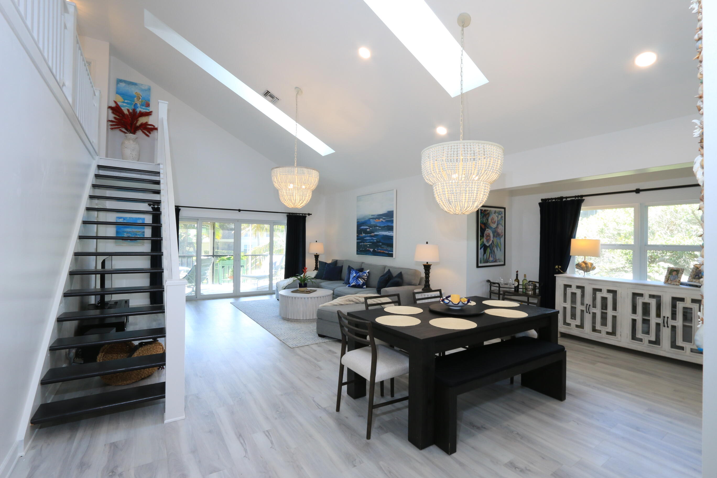 4161 U.S. Highway 1, Unit E3 Jupiter, FL 33477 - Photo 8 of 86 a living room with furniture and wooden floor