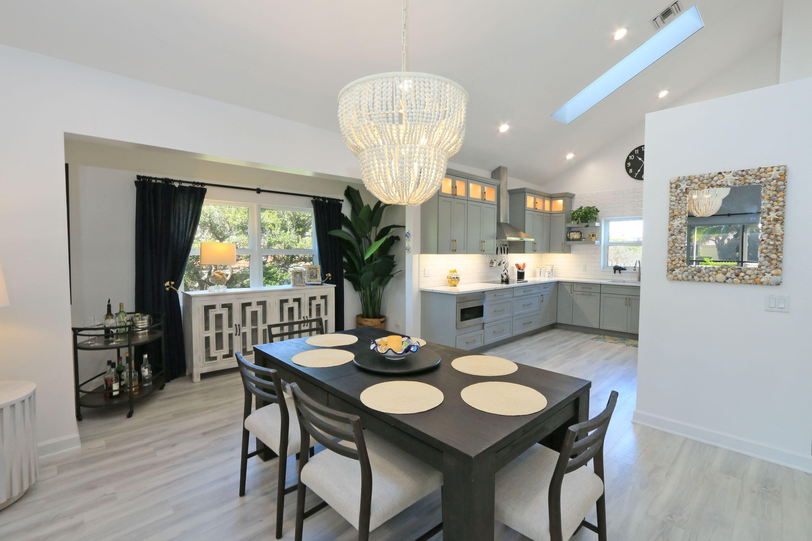 4161 U.S. Highway 1, Unit E3 Jupiter, FL 33477 - Photo 10 of 86 a view of a dining room with furniture window and wooden floor