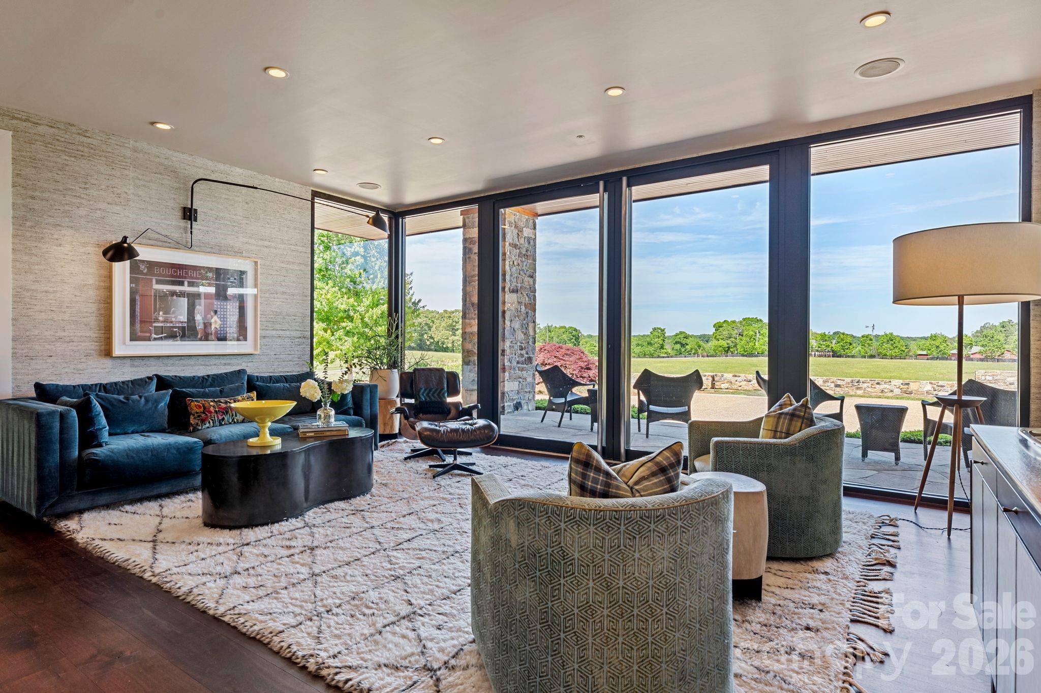 1795 Faires Road Rock Hill, SC 29730 - Photo 20 of 48 a living room with furniture and floor to ceiling windows