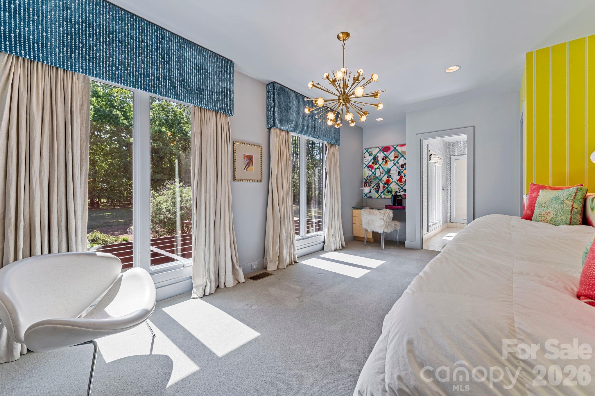 1795 Faires Road Rock Hill, SC 29730 - Photo 39 of 48 a bedroom with a bed and a chandelier