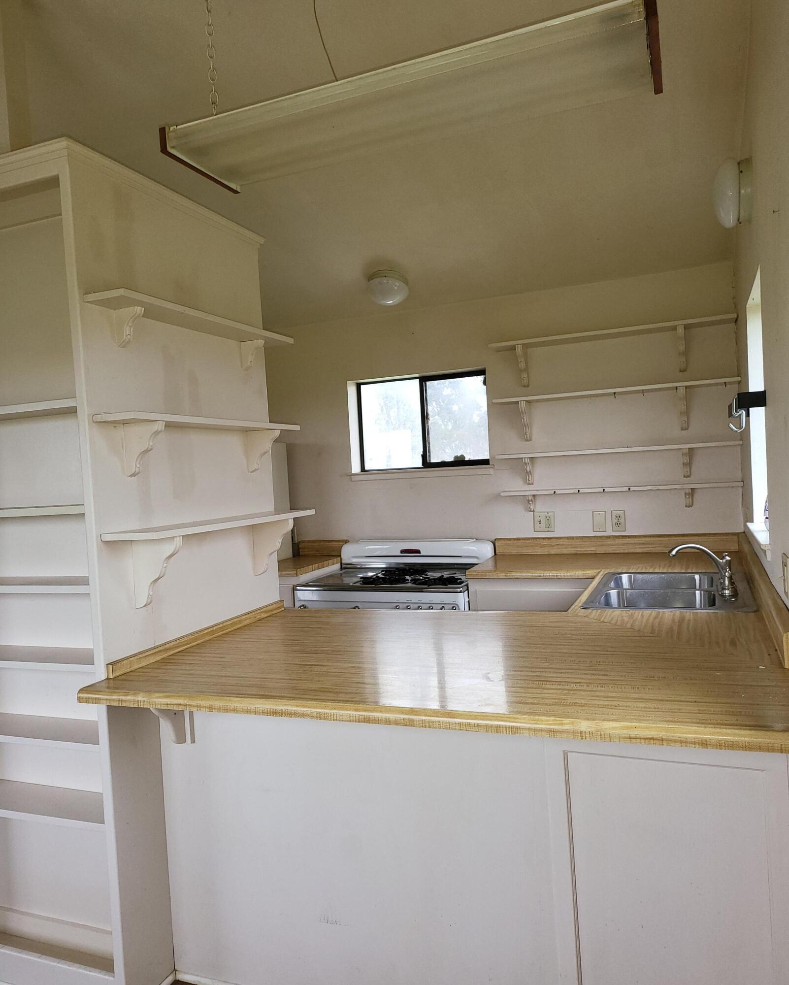 19009 Paskenta Road Corning, CA 96021 - Photo 12 of 33 a view of a kitchen counter space with a sink