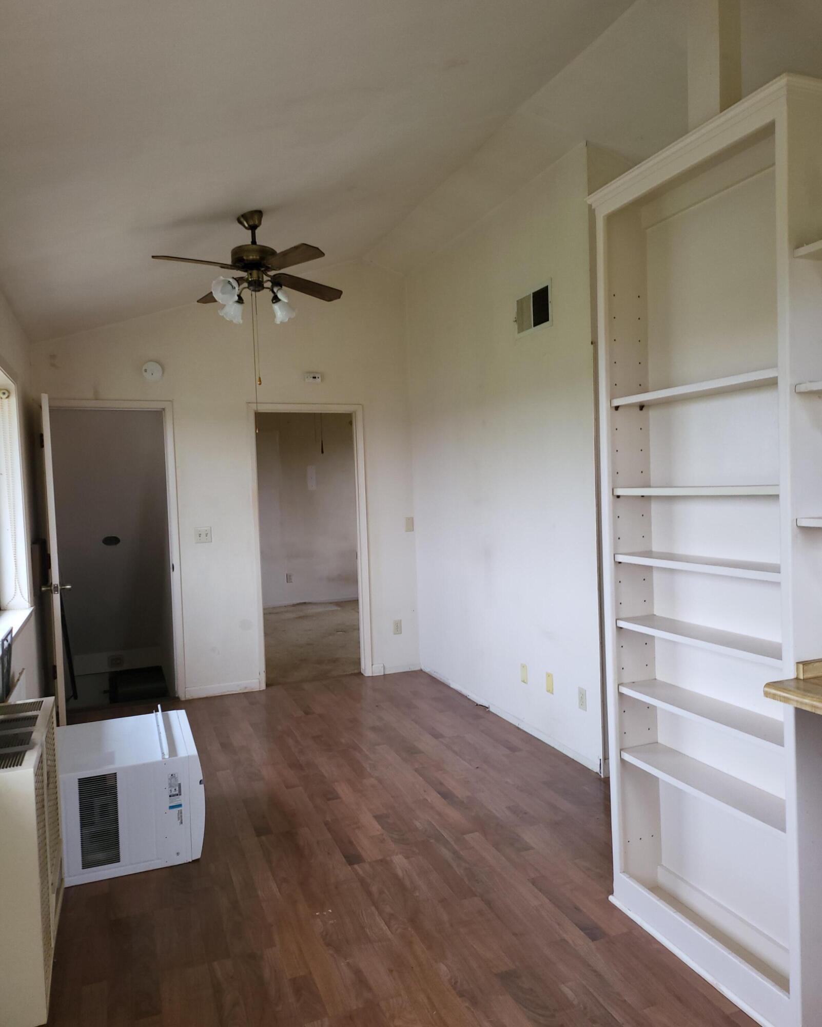 19009 Paskenta Road Corning, CA 96021 - Photo 14 of 33 a view of empty room with wooden floor and fan