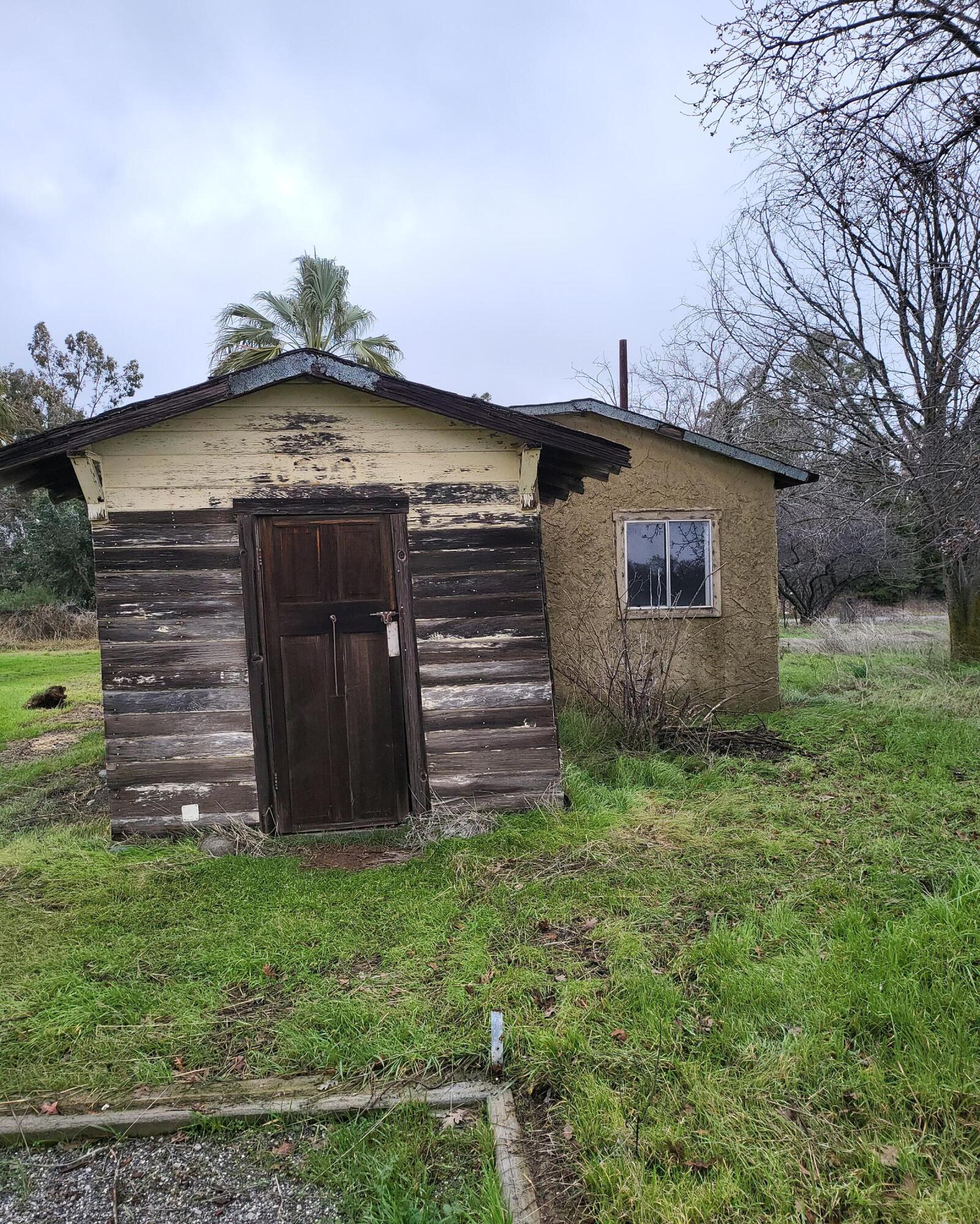 19009 Paskenta Road Corning, CA 96021 - Photo 32 of 33 a view of a house with a small yard and wooden fence