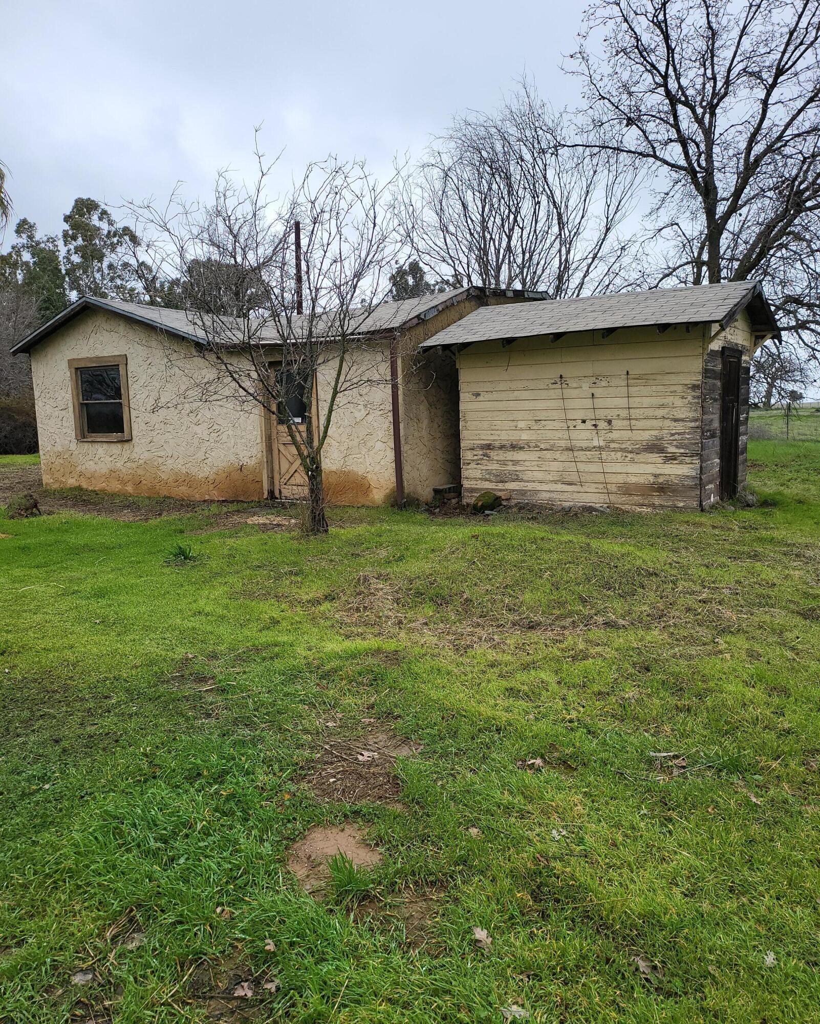 19009 Paskenta Road Corning, CA 96021 - Photo 33 of 33 a brick house with a large tree