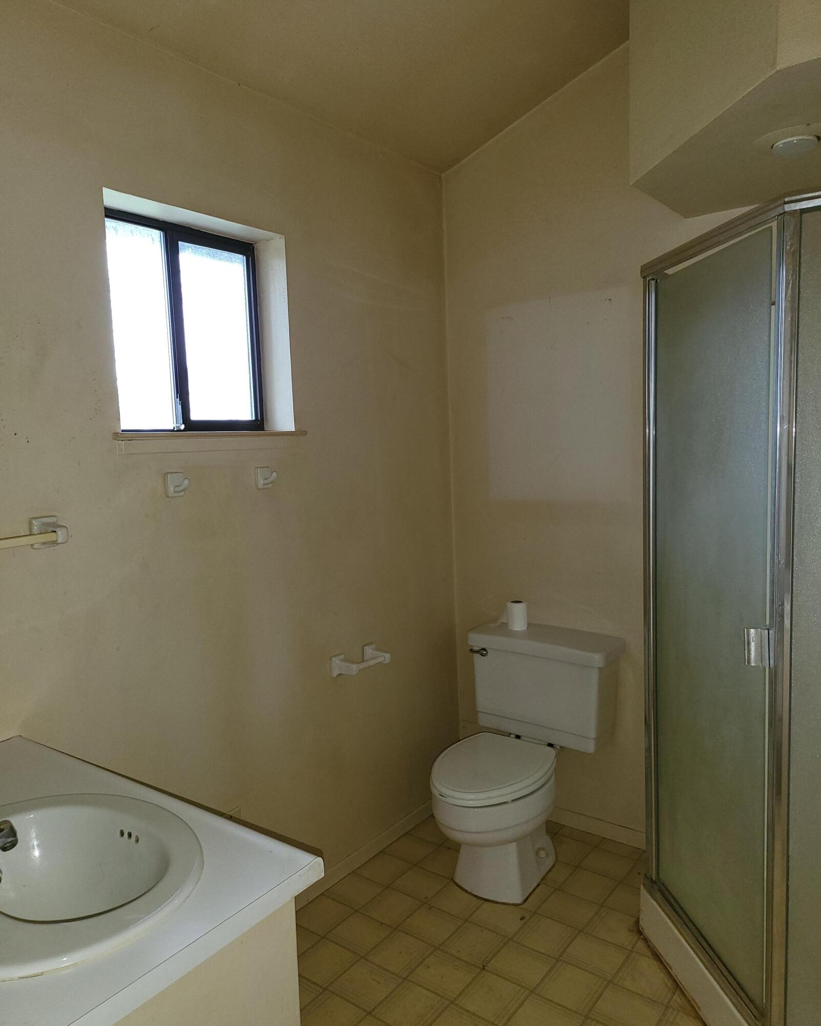 19009 Paskenta Road Corning, CA 96021 - Photo 6 of 33 a white toilet sitting next to a bathroom sink