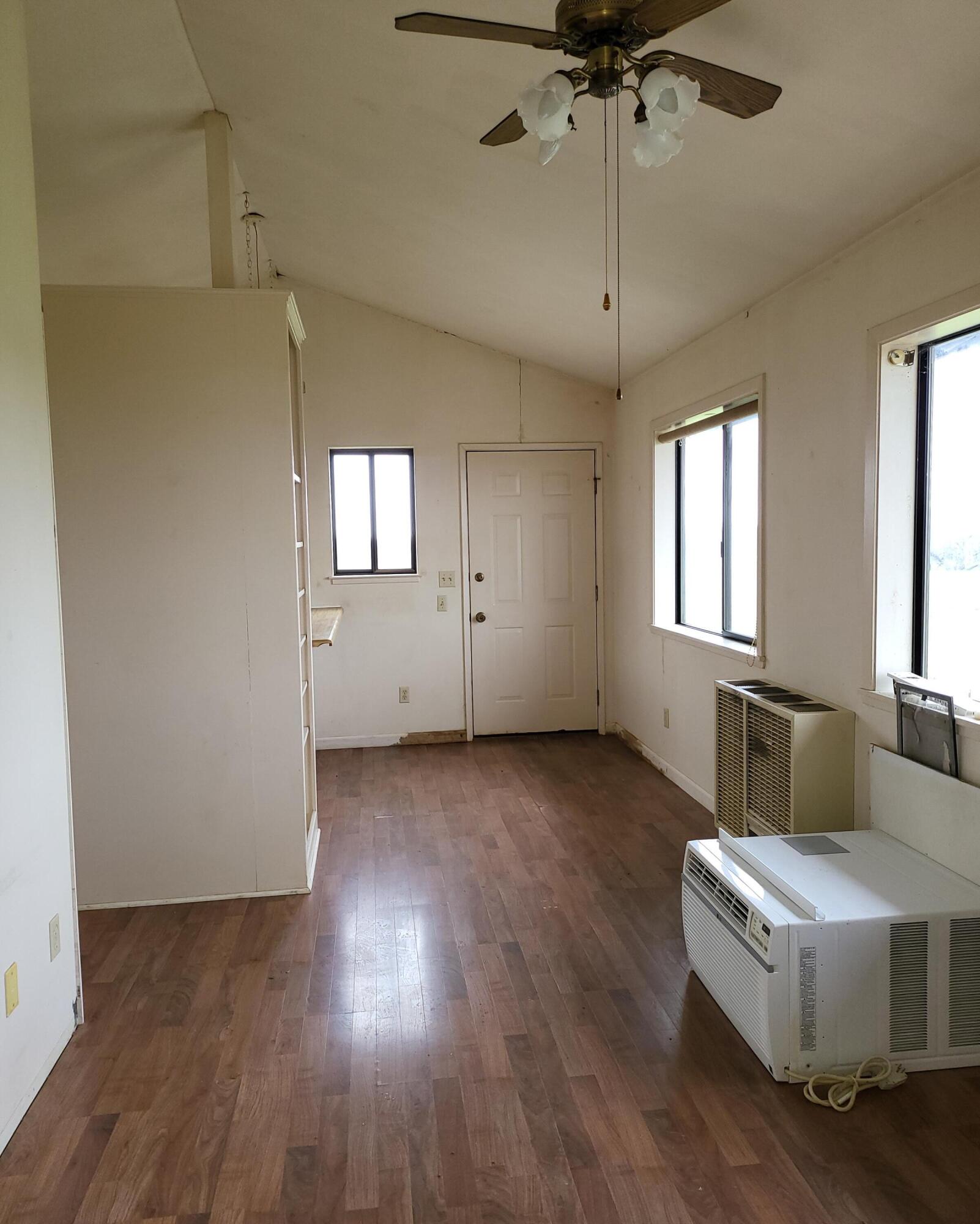 19009 Paskenta Road Corning, CA 96021 - Photo 9 of 33 a living room with hard wood floors and a ceiling fan