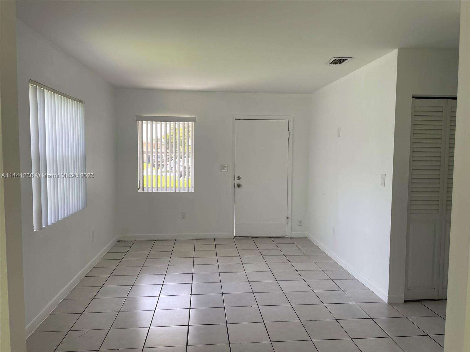 20048 Southwest 87th Place Cutler Bay, FL 33189 - Photo 2 of 11 a view of an empty room and window