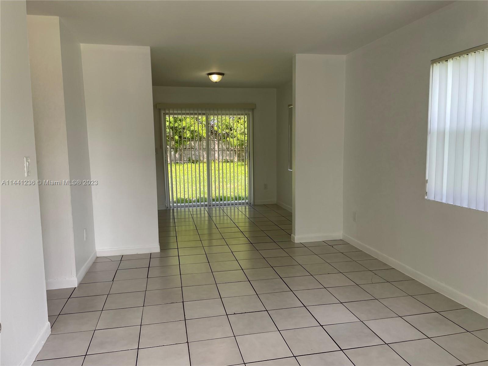 20048 Southwest 87th Place Cutler Bay, FL 33189 - Photo 3 of 11 a view of an empty room and window