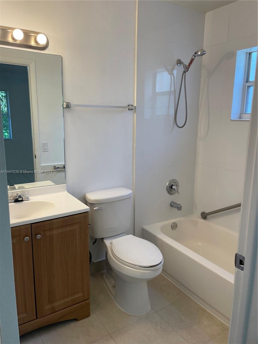 20048 Southwest 87th Place Cutler Bay, FL 33189 - Photo 7 of 11 a bathroom with a sink a toilet and shower