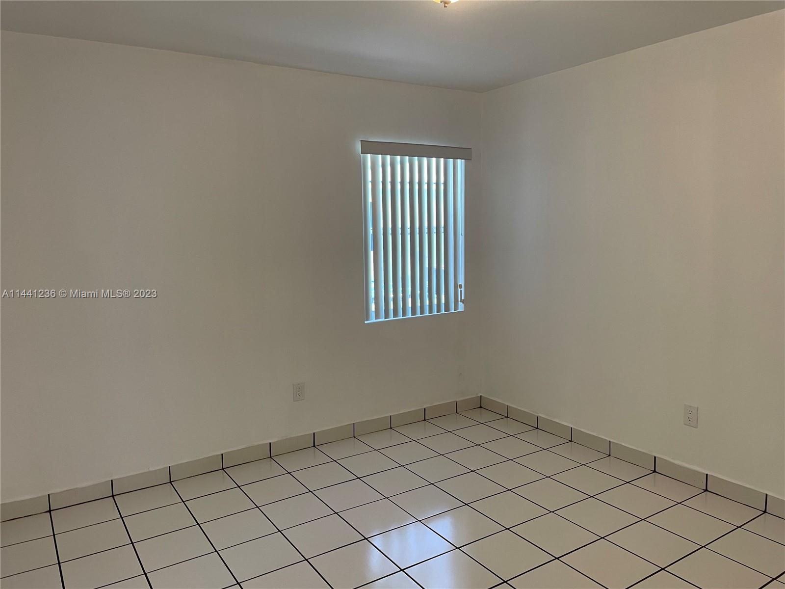 20048 Southwest 87th Place Cutler Bay, FL 33189 - Photo 10 of 11 a view of a window and a window