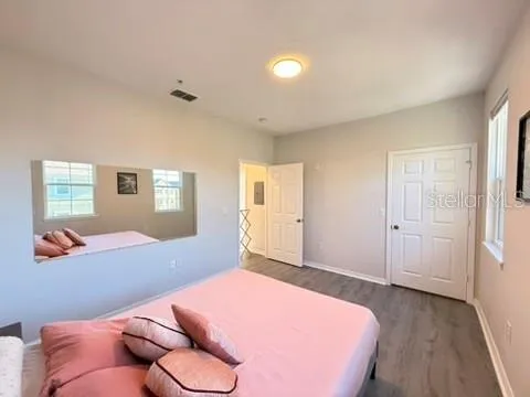 a bedroom with a bed and window