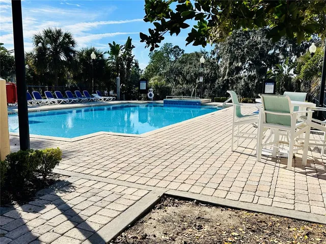 a view of swimming pool with lounge chair