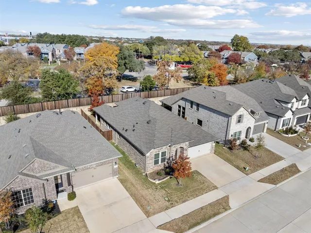 an aerial view of a house with a garden