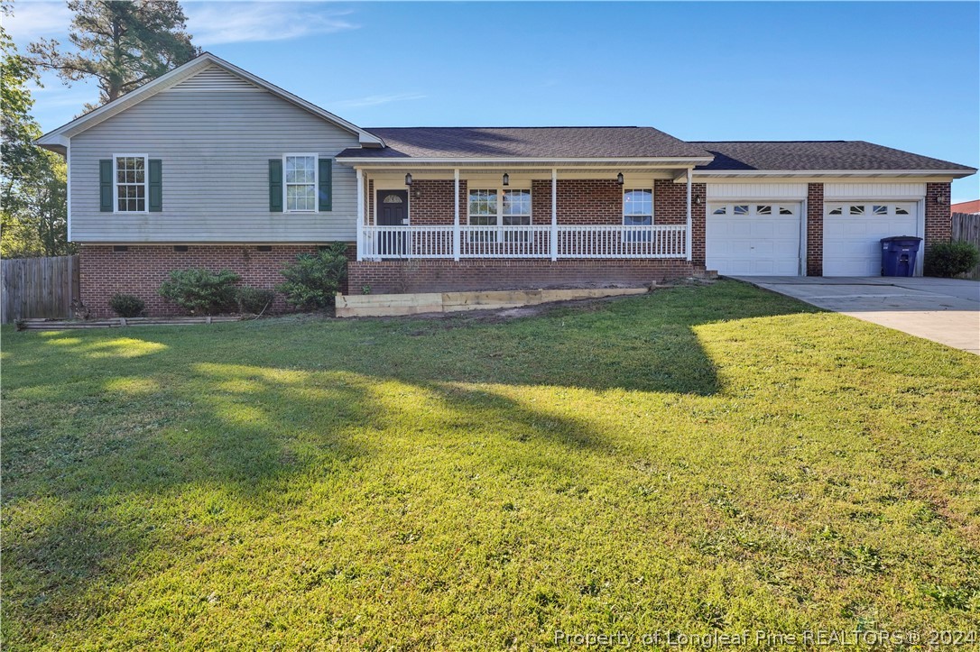 229 Lakeside Road Raeford, NC 28376 - Photo 1 of 17 a front view of a house with a yard