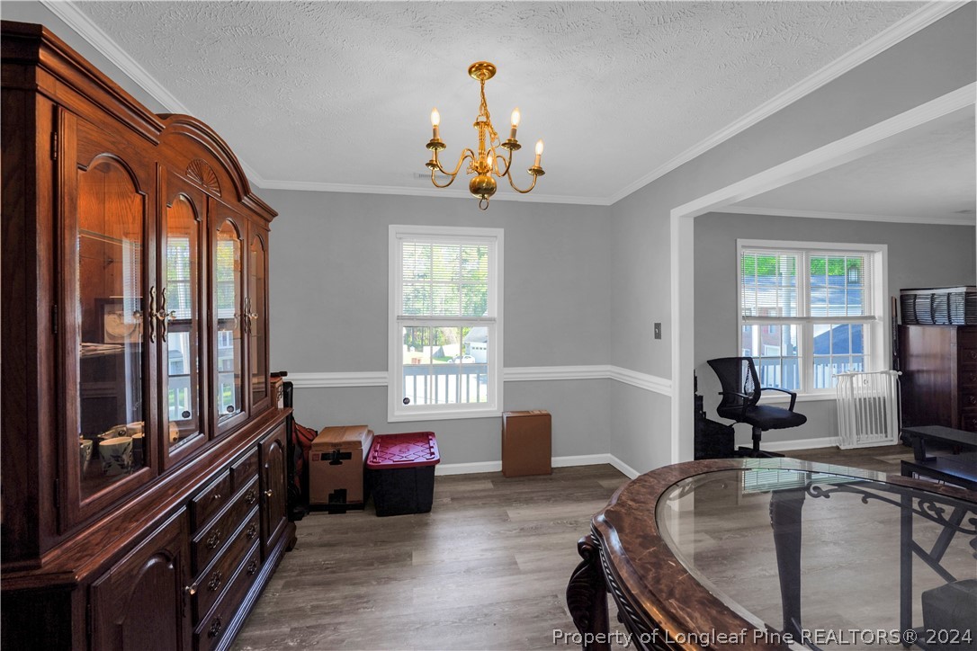 229 Lakeside Road Raeford, NC 28376 - Photo 11 of 17 a living room with furniture flowerpot and a window
