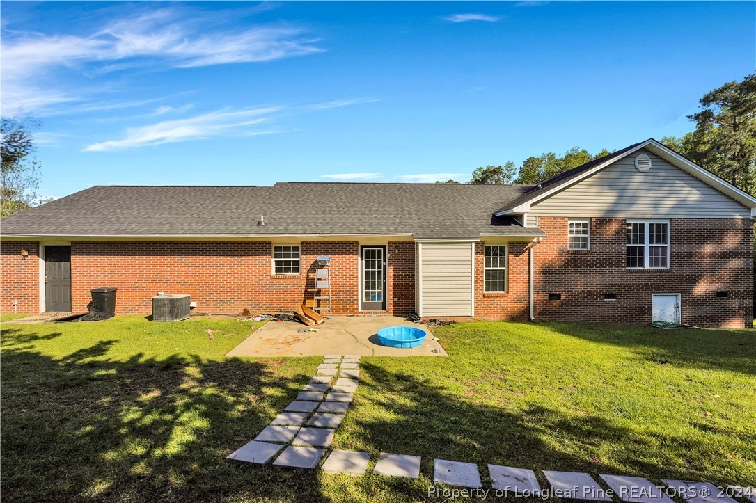 229 Lakeside Road Raeford, NC 28376 - Photo 16 of 17 a view of a house with a big yard