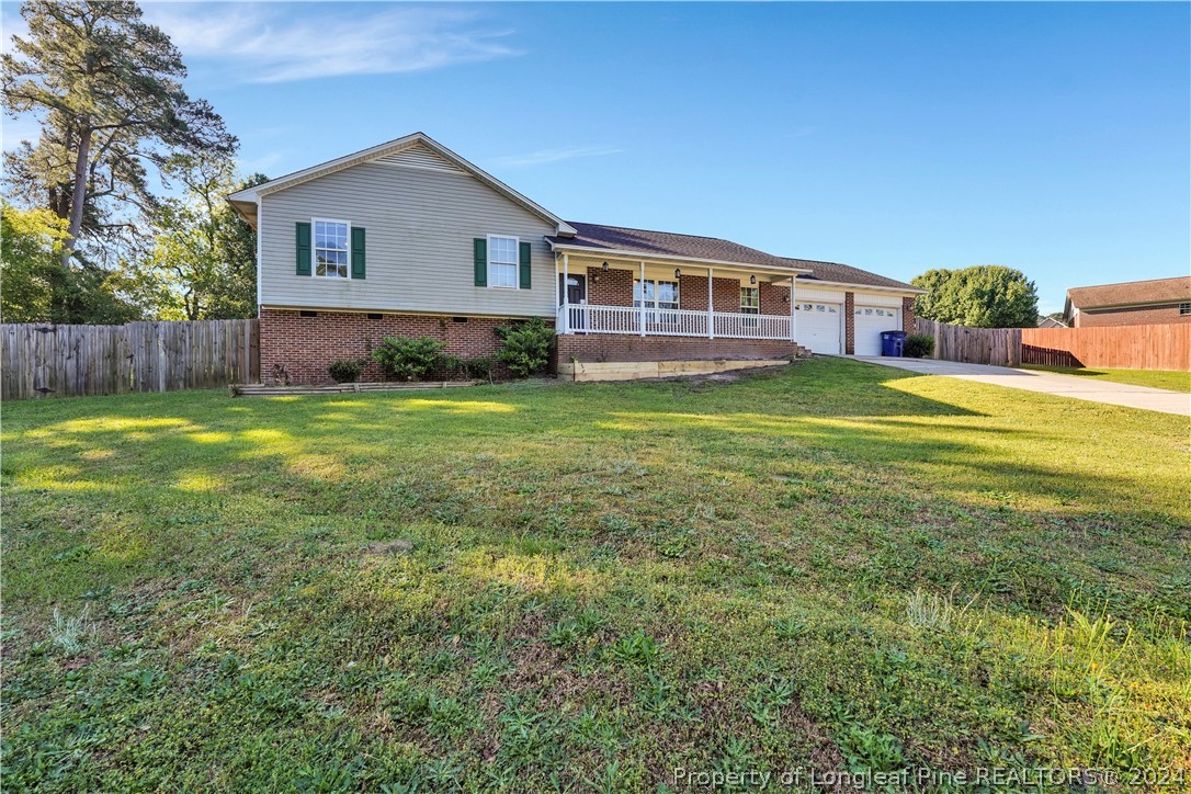 229 Lakeside Road Raeford, NC 28376 - Photo 2 of 17 a front view of a house with a yard